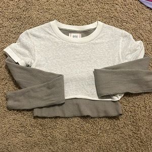 Small urban outfitters BDG cropped long sleeve green and white top.